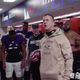 Baltimore Ravens head coach John Harbaugh delivers a locker room speech after the team’s victory over the Houston Texans as defensive tackle Domata Peko and his stomach tattoo look on.